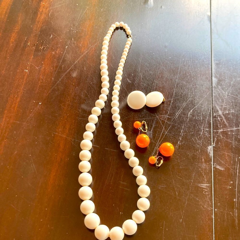 Vintage set of two white clip on earrings 28” bead necklace orange drop earrings